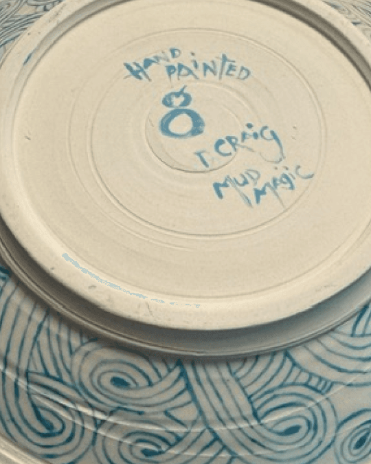 The hand-painted maker's mark on the back of a Georgia Perkins plate